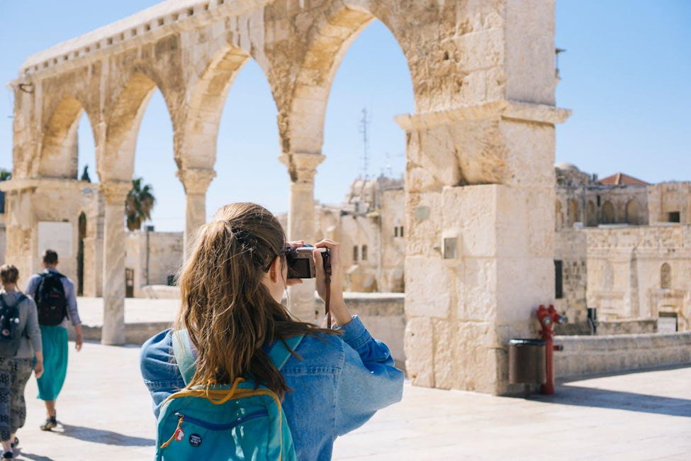 Woman taking photos of the ruins