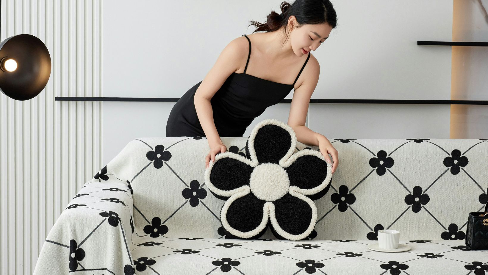 Person putting a pillow on a couch